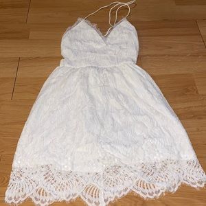 Beautiful white lace mini dress with tie up open back.